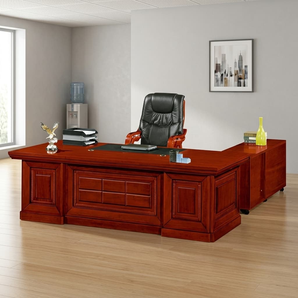 2.2m mahogany L-shaped executive office desk with inlaid black leatherette writing pad, dual cable grommets, mobile 2-drawer pedestal, and low side credenza return unit on casters.