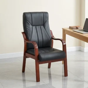 Black leather executive visitor chair with contoured high backrest, vertical accent stitching, curved mahogany wood armrests, and 4-leg mahogany frame.