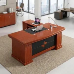 1.6m cherry wood L-shaped executive desk with black inlaid leatherette writing pad, dual circular cable grommets, two-tone diamond modesty panel, and integrated side return cabinet.