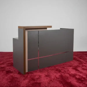 1.6m two-tone reception desk with walnut counter riser, dark gray work surface surround, integrated lockable drawer and pedestal cabinet, and cable grommet cutout.