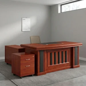 1.8m mahogany executive office table with black leatherette writing inlay, decorative vertical slatted modesty panel, side credenza, and mobile 2-drawer pedestal.