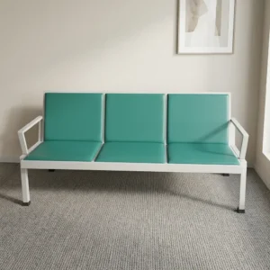 3-seater teal green vinyl reception waiting bench with padded seat cushions, integrated backrests, angular white metal armrests, and a matching steel frame.