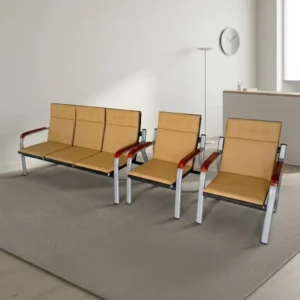 5-seater beige leatherette reception waiting set featuring a 3-seater bench and two single armchairs with square-tufted headrests, mahogany-finish armpads, and silver steel sled frames.