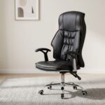 Black leatherette high-back reclining executive office chair with contrast red stitching, tufted backrest padding, padded armrests, and a chrome 5-star swivel base.