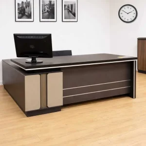 1.8m dark brown executive L-shaped desk with silver accent lines on modesty panel, two-tone beige pedestal leg with fluted vertical slatting, and integrated side return cabinet.