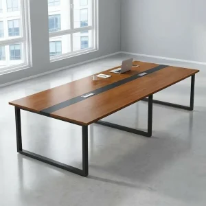 12-seater teak wood laminate rectangular conference table with central black wire inlay strip, flip-top cable grommets, and black metal O-leg frame.