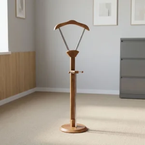 Modern office suit valet stand coat hanger with walnut finished wooden frame, contoured shoulder hanger, stainless steel support struts, trouser bar, and weighted round base.