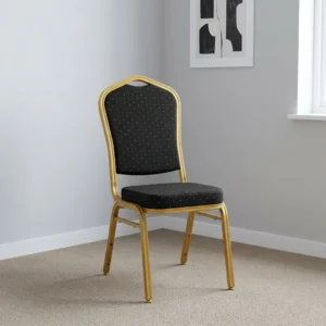 Black stackable banquet chair with gold-patterned fabric upholstery, crown back frame, gold powder-coated steel legs, and integrated hand-hold handle