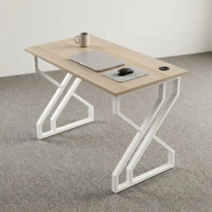 120cm light oak office table with rectangular laminate top, single cable grommet, and geometric white metal double-X leg frame.