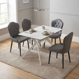 4-seater white marble top dining set with rectangular white X-frame trestle legs and four gray button-tufted upholstered chairs.